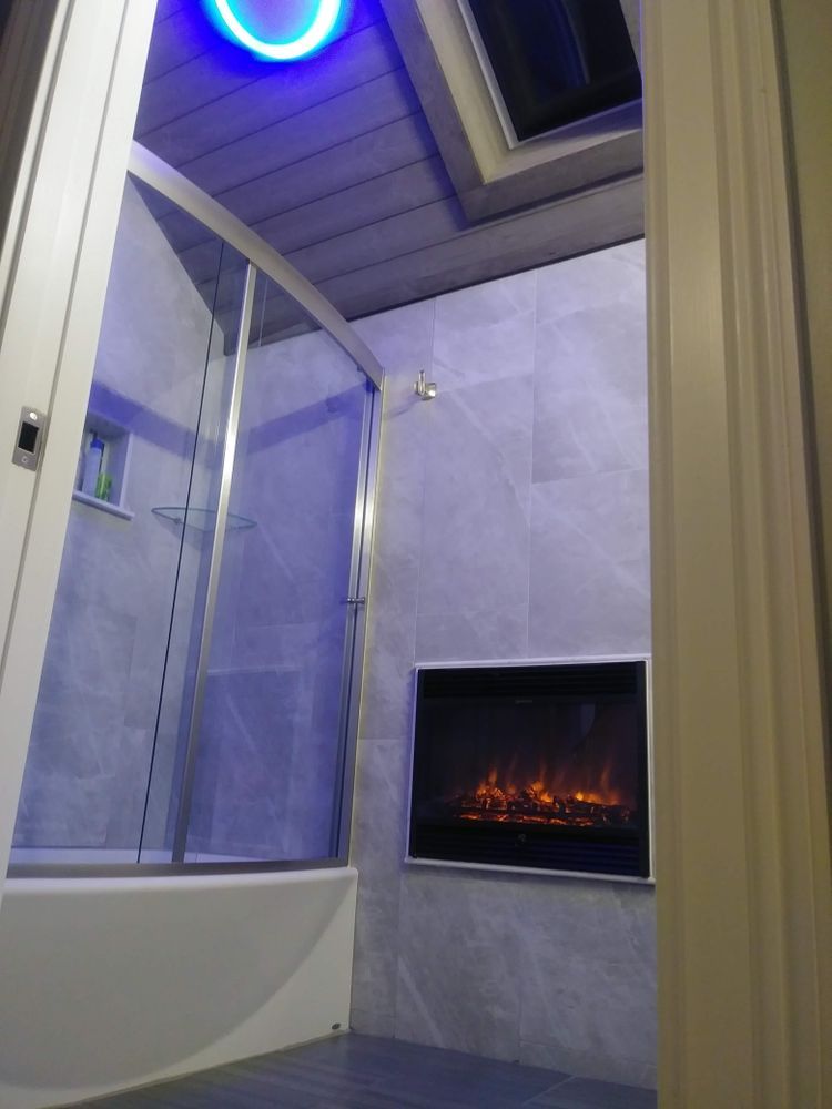 A bathroom with a fireplace and a bathtub