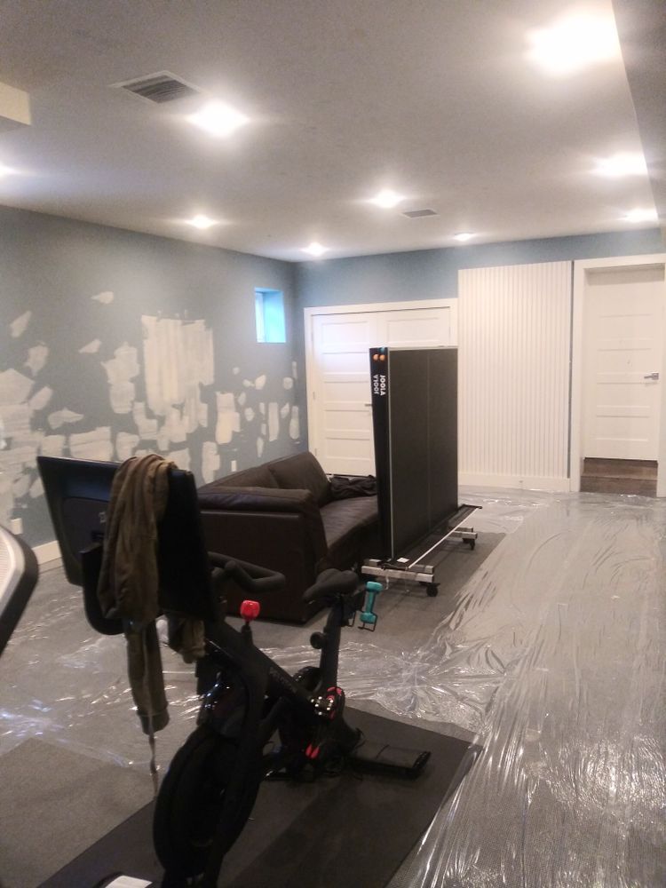 A room with a couch and a bike in it