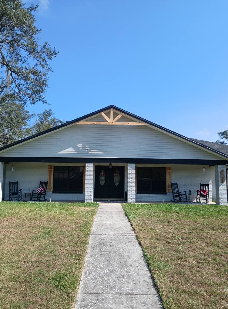 A house with a concrete walkway leading to it