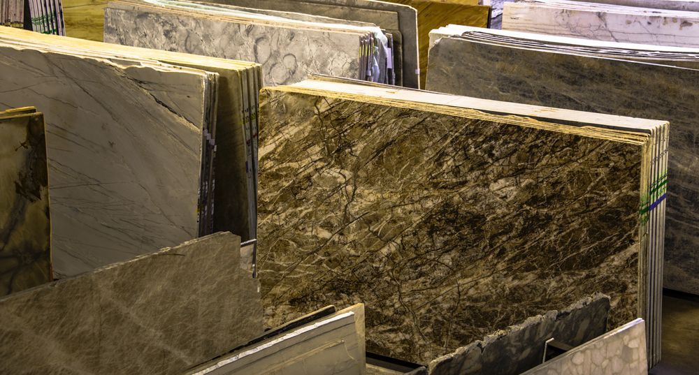 A Row Of Marble Slabs Stacked On Top Of Each Other In A Warehouse — Tile Power Dubbo In Dubbo, NSW