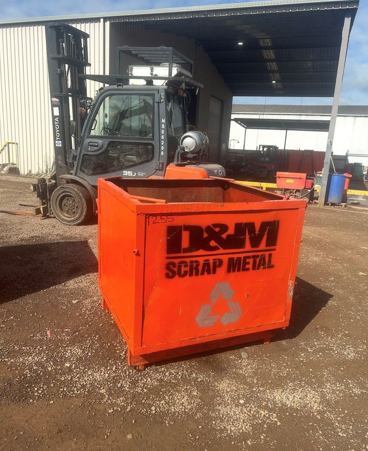 An orange metal bin.