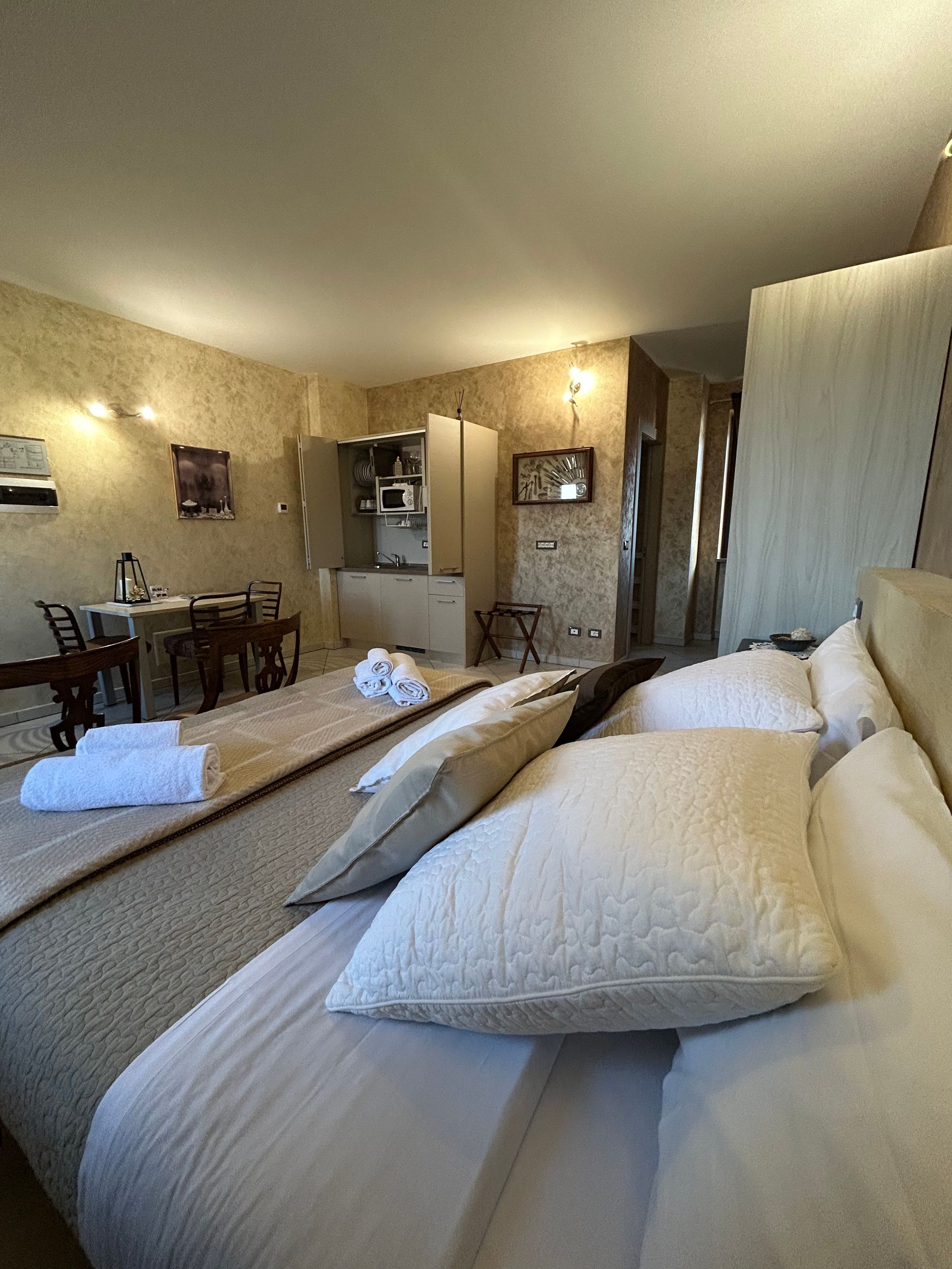Golden Sands studio apartment overview with double bed and private kitchen in the background