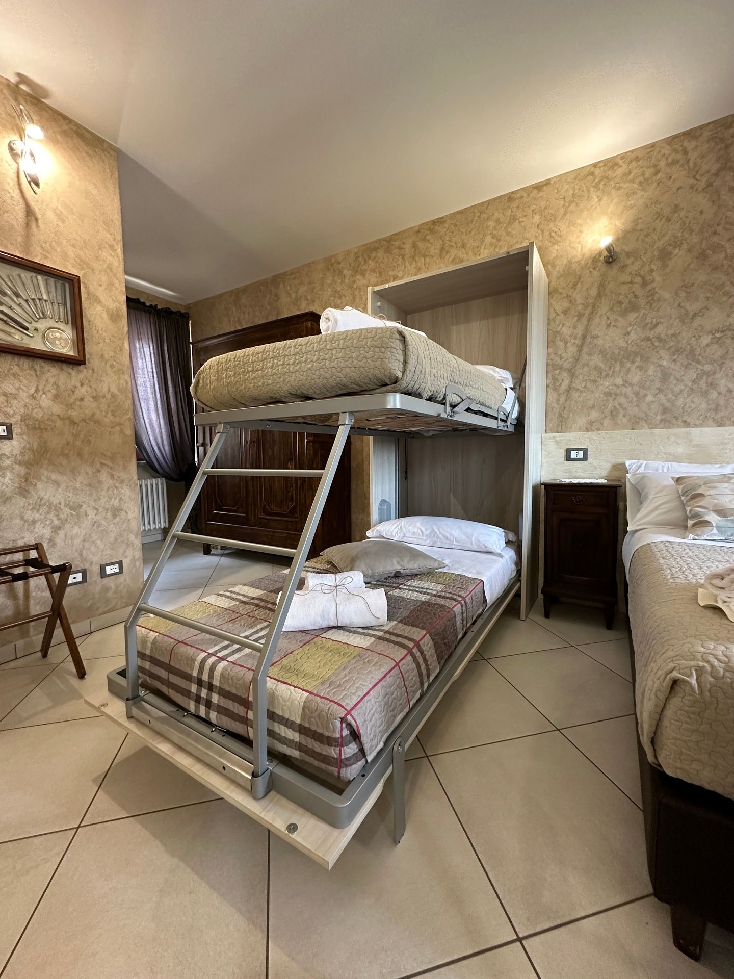 Golden Sands apartment bedroom with double bed, bunk bed, soft linens