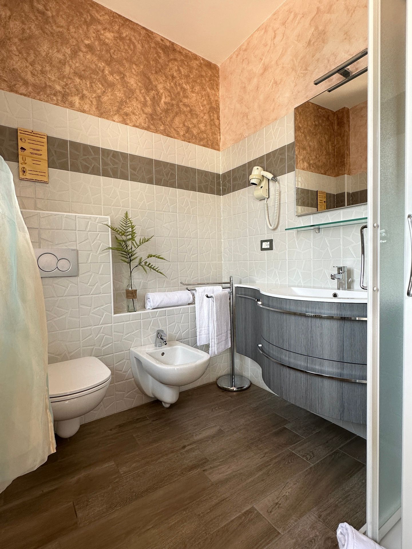 Modern bathroom with window, in Salt Crystals apartment with shower, bidet, hairdryer and soft towels