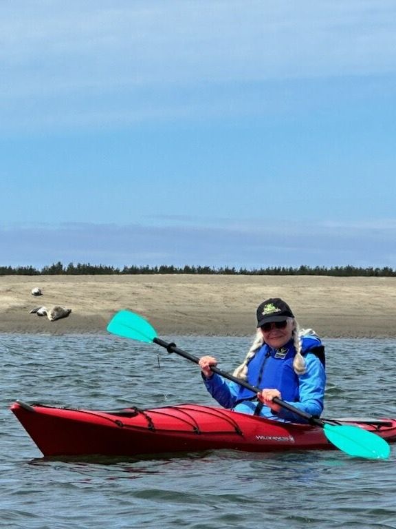 photo of WEBS Administrative Assistant, Vicky Snow, kayaking on Netarts Bay