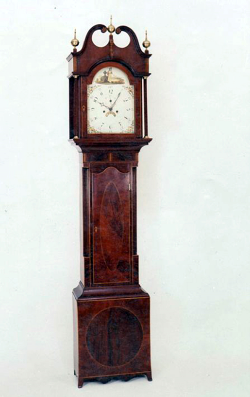 A grandfather clock restoration, emphasizing timeless design.