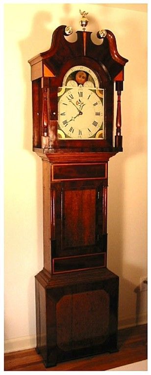 Grandfather clock restoration of an antique wooden-framed clock with timeless elegance and detail.