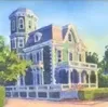 Victorian-style house with blue trim and a tower, shown on a sunny street corner