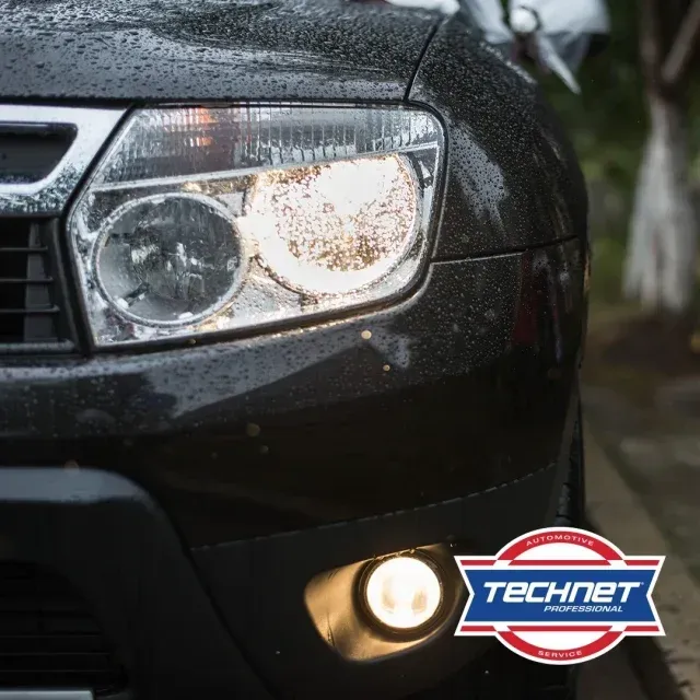 Headlight of a black car - AK Auto Repair
