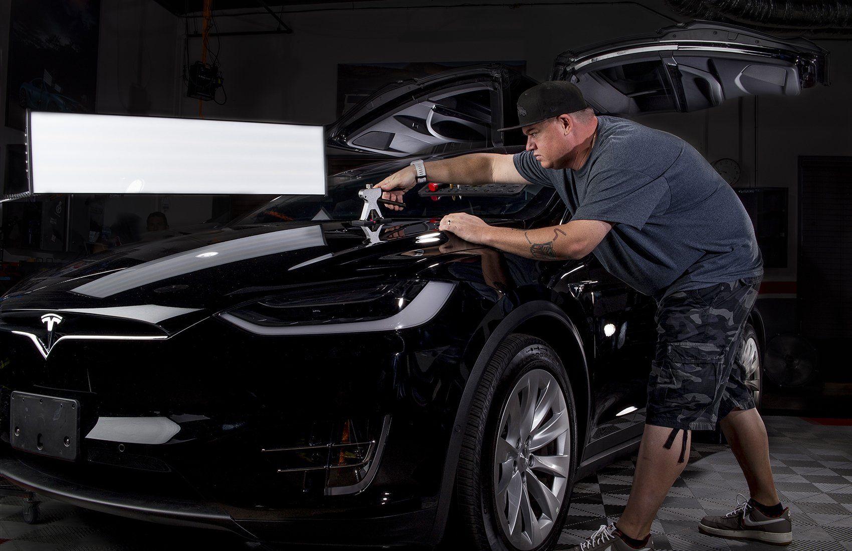 Tesla paintless door dent removal in Boca Raton