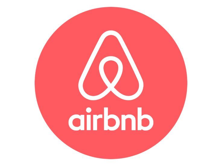 Airbnb logo: white icon and wordmark on a coral red circle