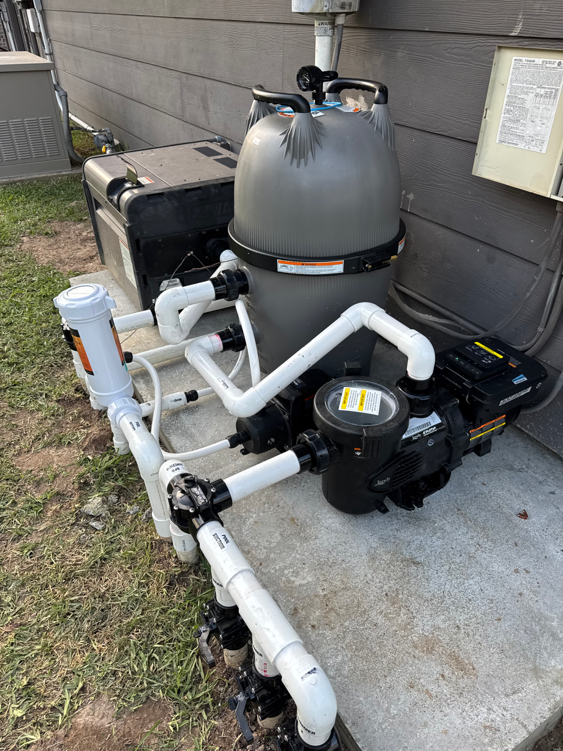Pool equipment installation with pump, filter, heater and plumbing by Aqua Tek Pools in Greater Houston.