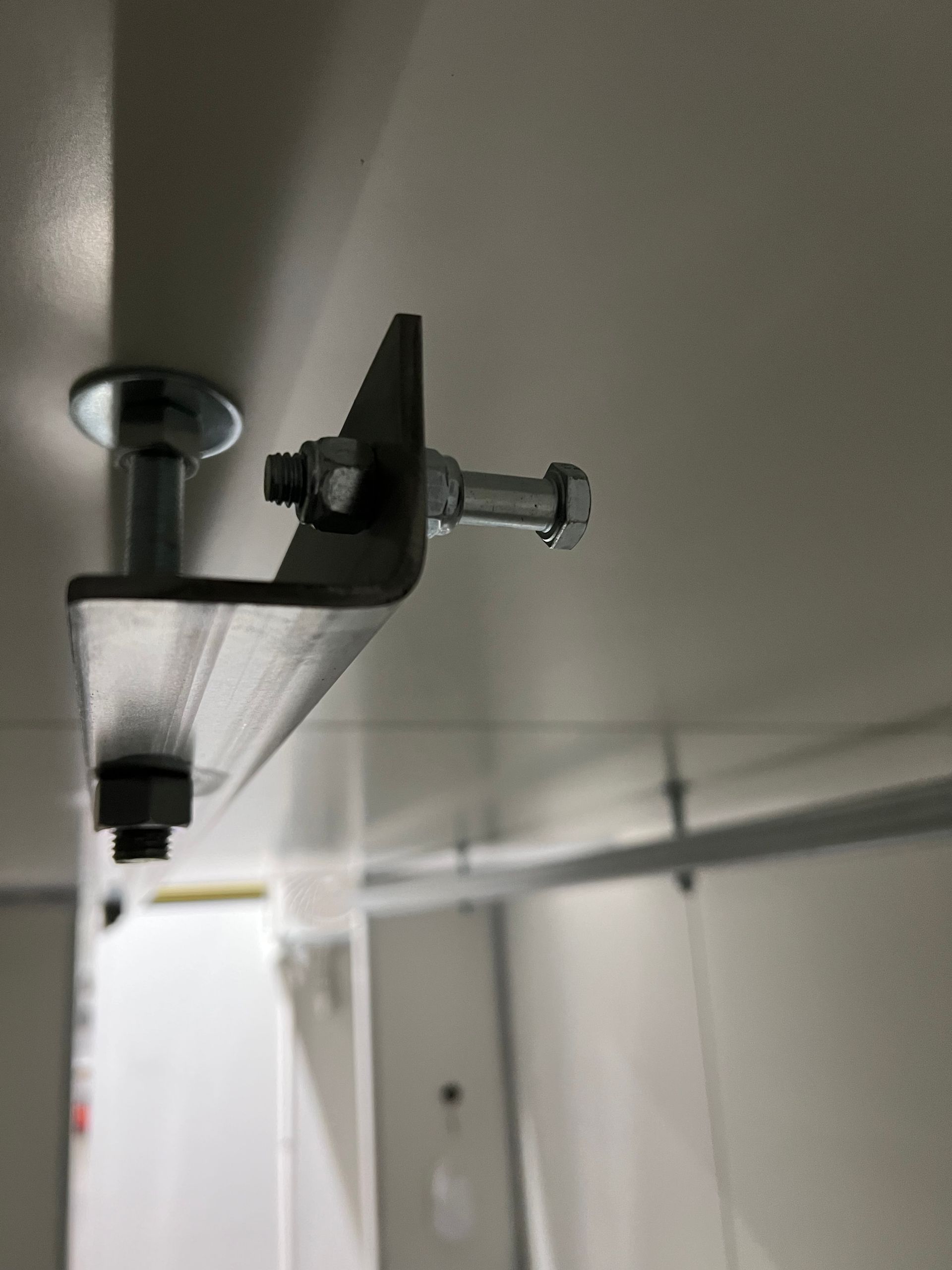 Meat rail stop for portable coolrooms