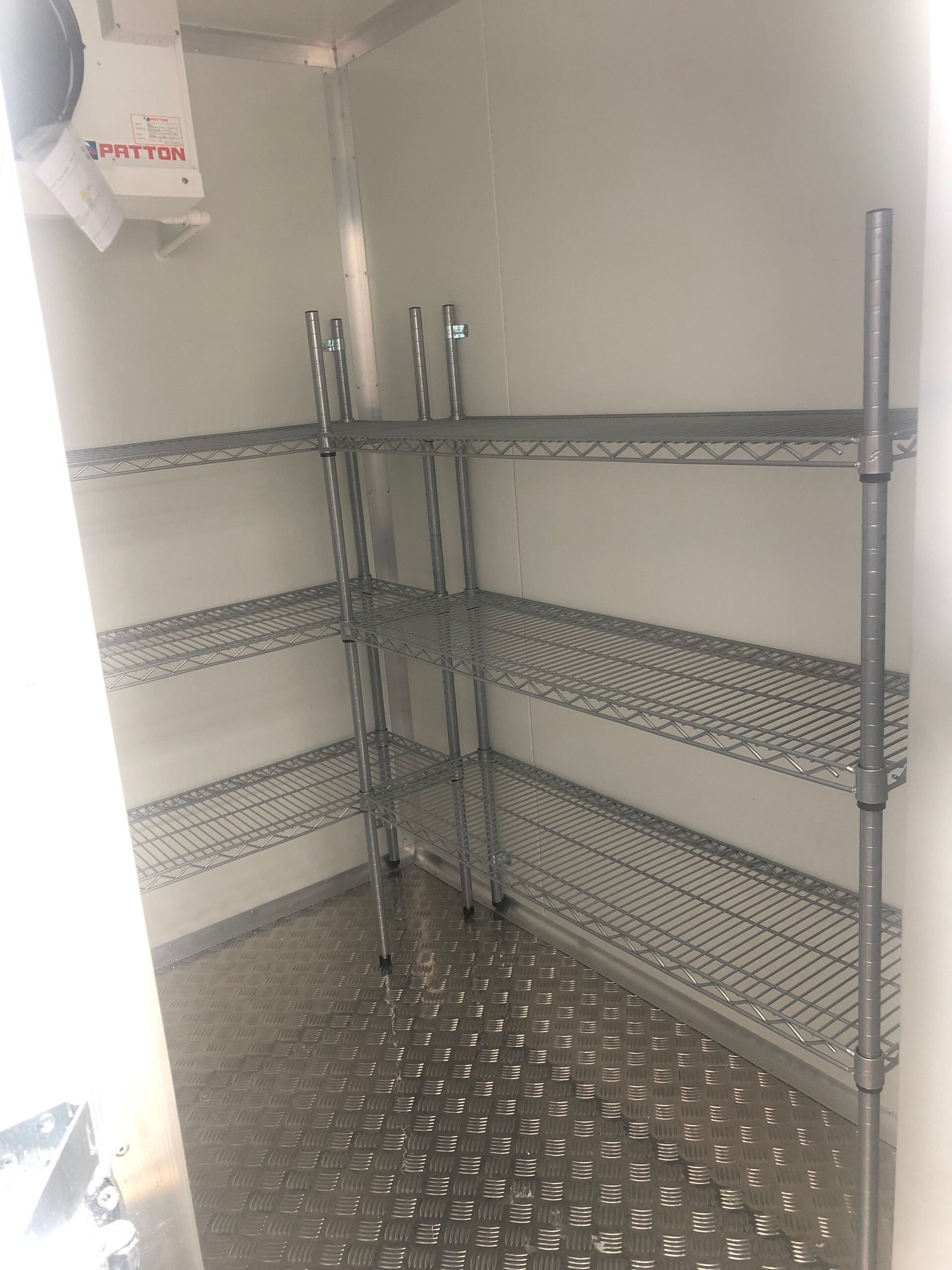 Shelving in portable coolrooms
