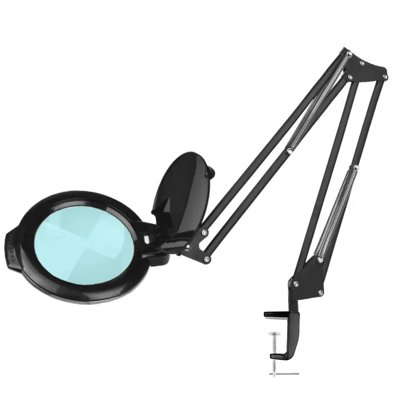 Lampada d'ingrandimento bianca con lente blu e braccio regolabile su base a morsetto.