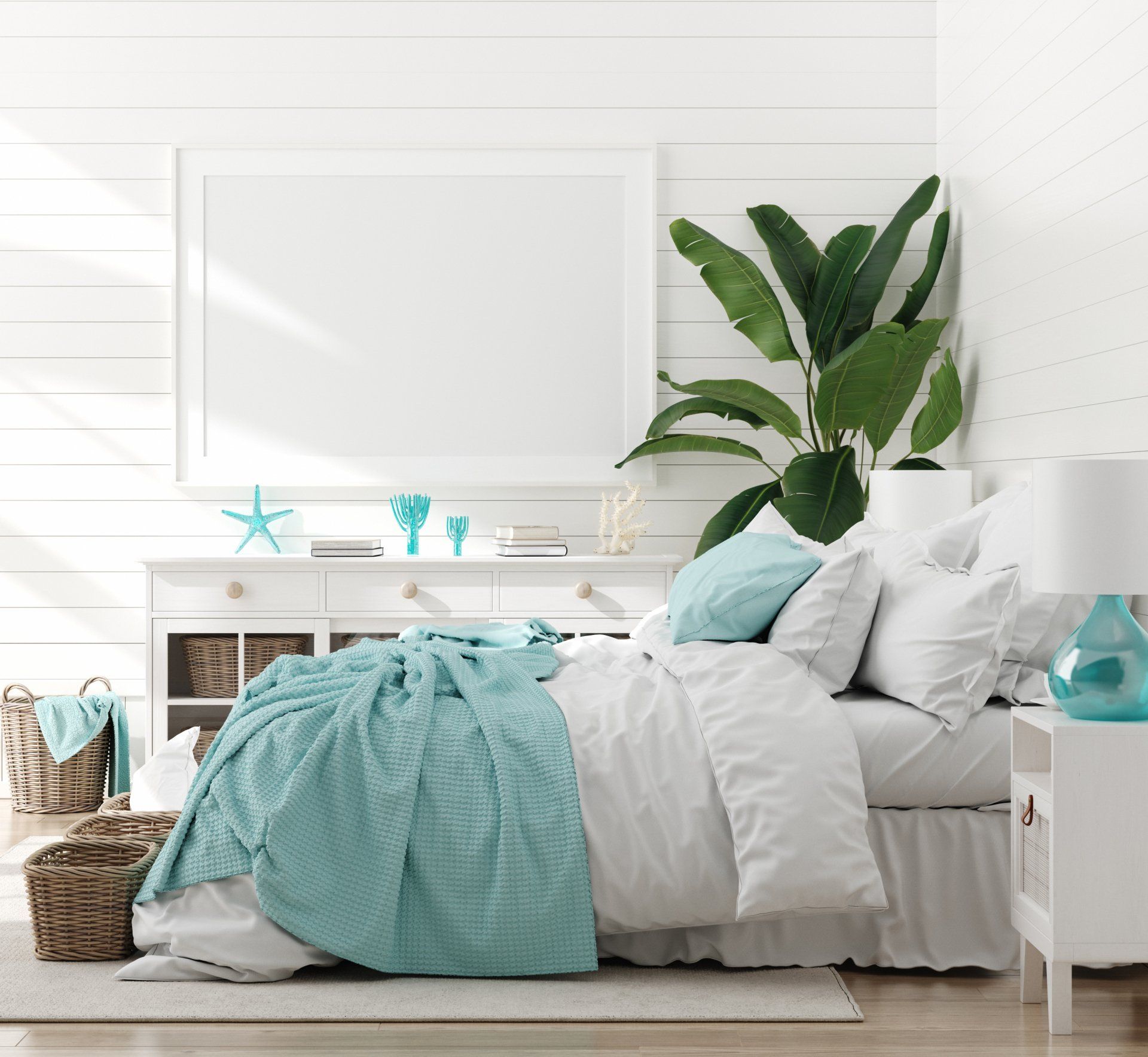 A bedroom with a bed , nightstand , lamp and a picture frame on the wall.