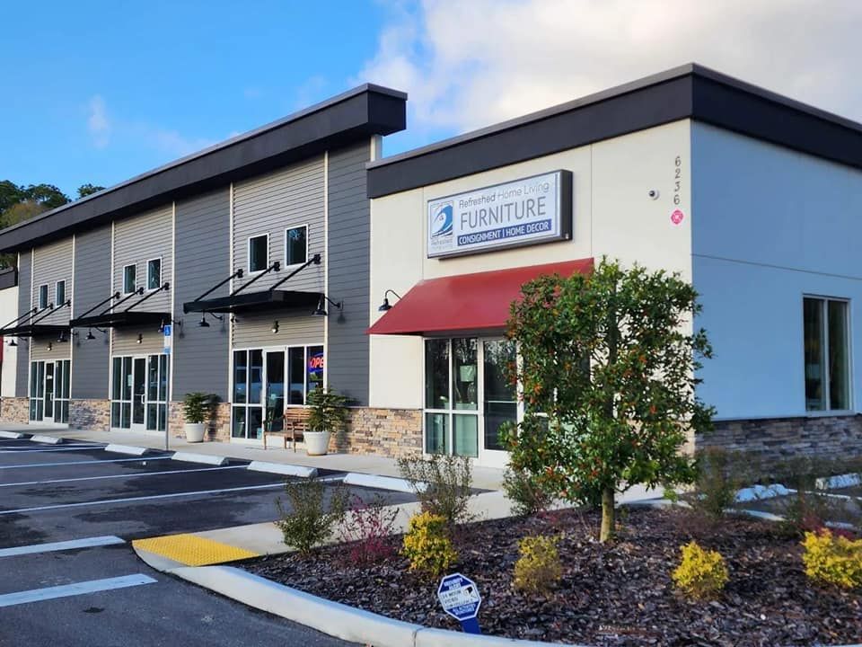 A large building with a red awning on the front of it.