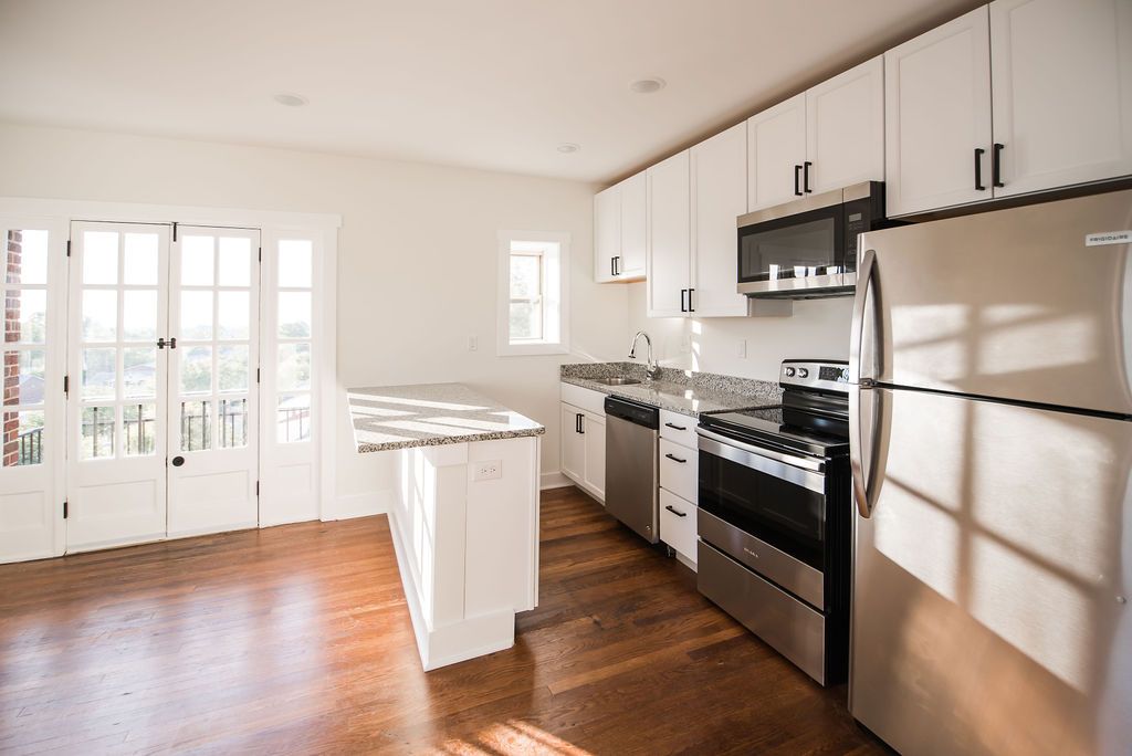 Fort Mitchell Flats - Open living room with kitchen  with appliances