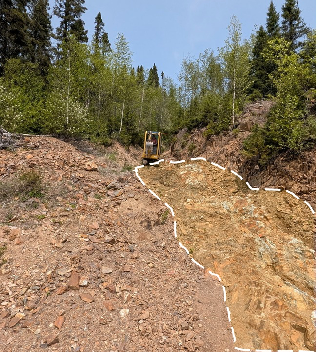 Photo 1: Surface preparation works underway at Lac Arsenault’s “Baker Vein” area. Note the precious metal mineralized quartz vein system is at surface. (highlighted)