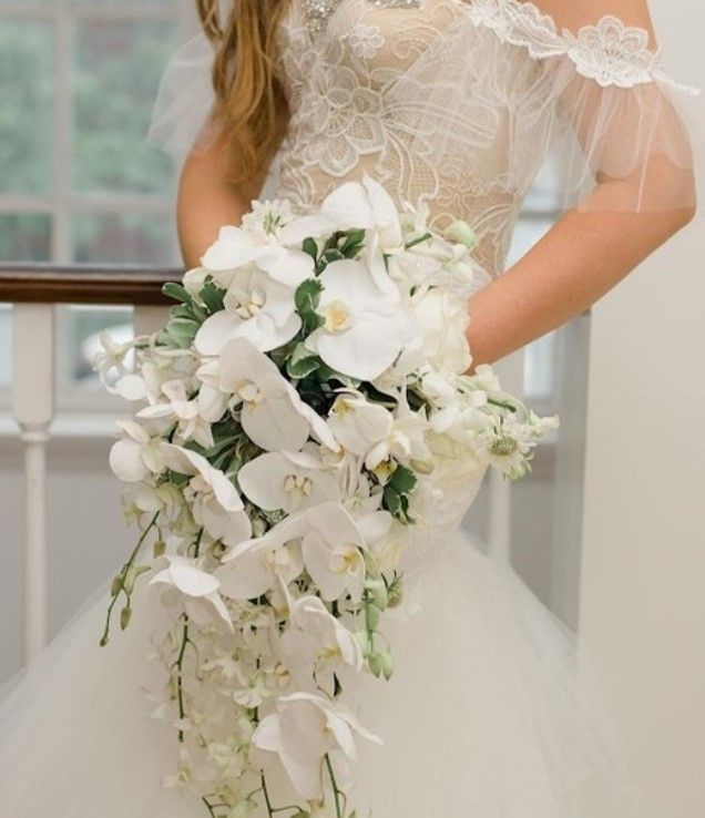 Tulips Floral Design | Westbrook, CT all white bridal bouquet with orchids