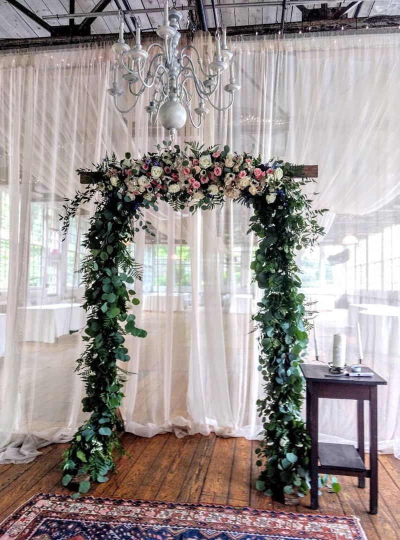 Tulips Floral Design located in Westbrook, CT creates beautiful wedding flower arches.