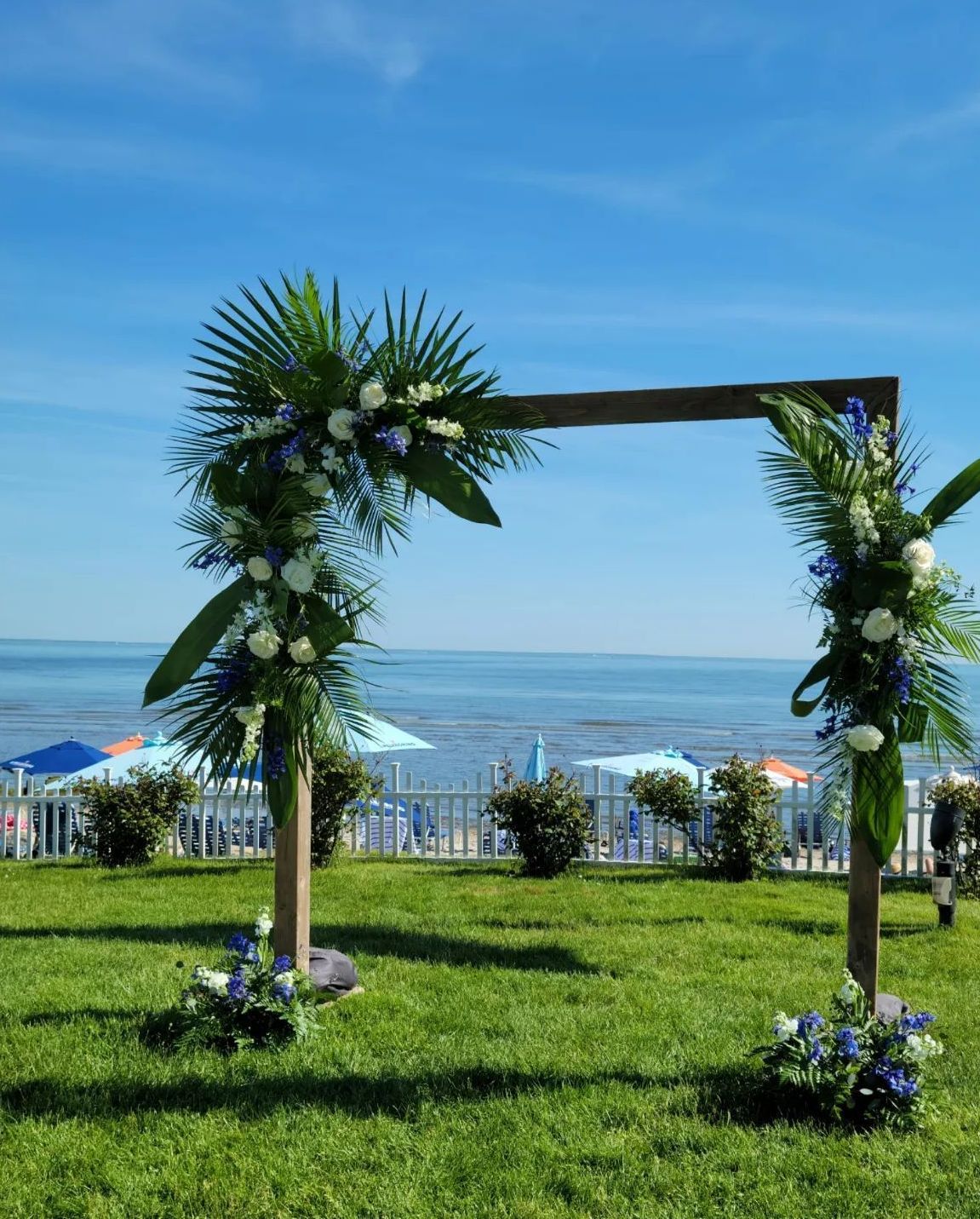 Tulips Floral Design located in Westbrook, CT creates beautiful wedding flower arches.
