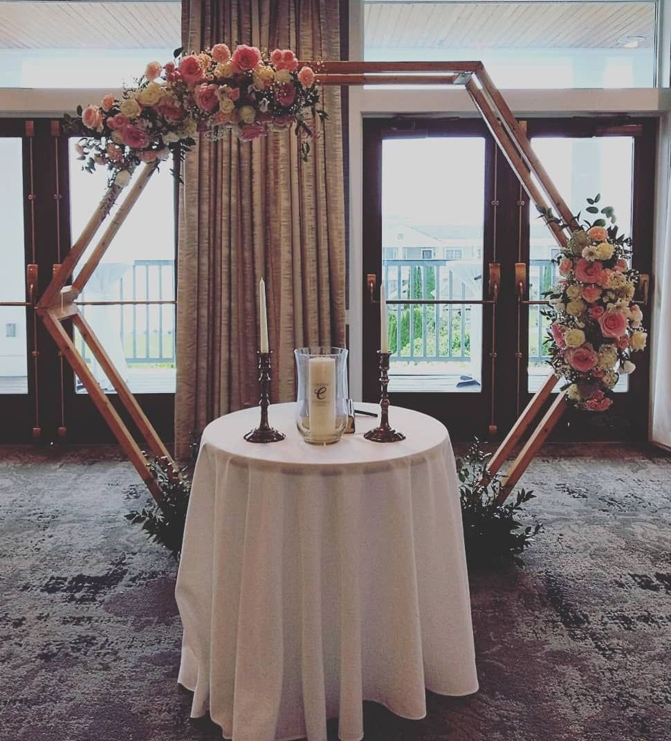 Tulips Floral Design located in Westbrook, CT creates beautiful wedding flower arches.