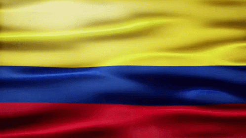 Colombian flag with yellow, blue, and red horizontal stripes waving gently