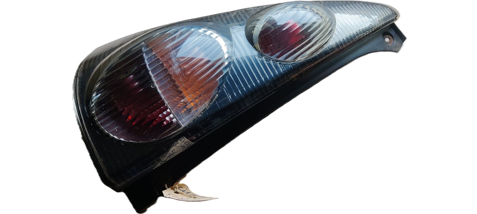 Een zwarte achterlichtunit voor auto's met twee ronde, doorschijnende lichtlenzen tegen een effen witte achtergrond.