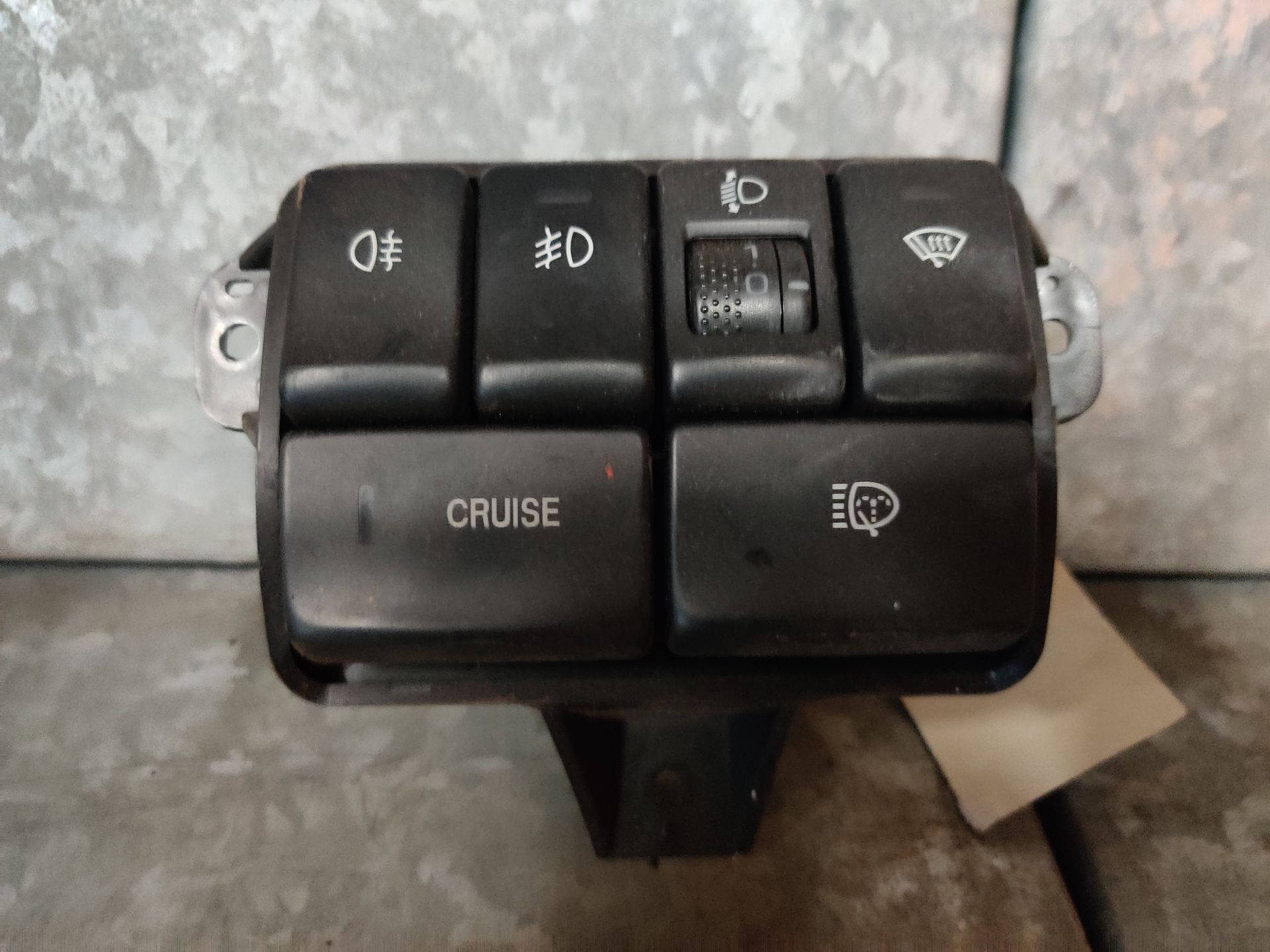 Subaru Forester schakelaars voor de koplamphoogte, cruise control, ruitensproeier.