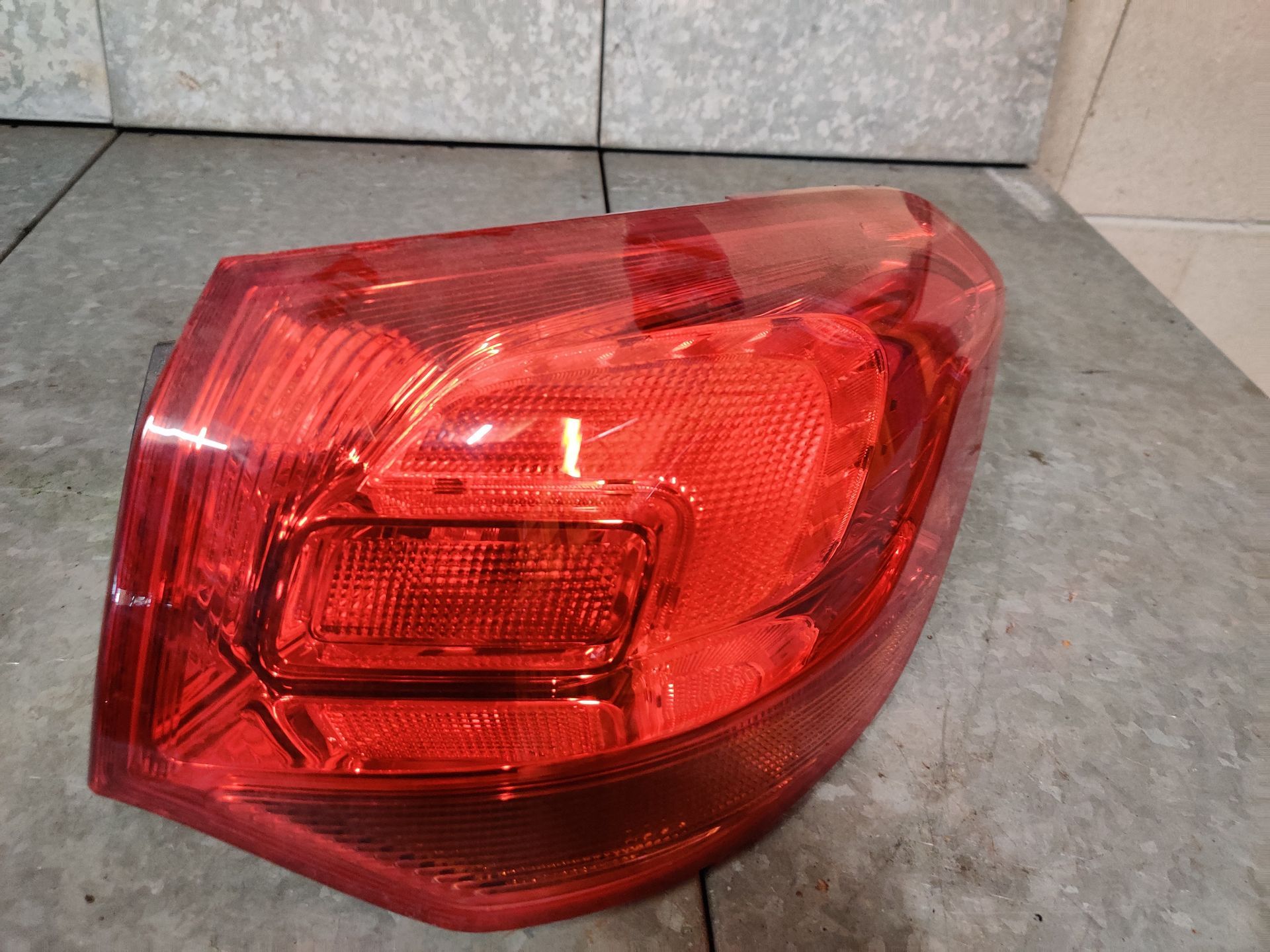 Opel Astra J rechter achterlicht van een 1.4i sports, station uit 2013, gebruikt.