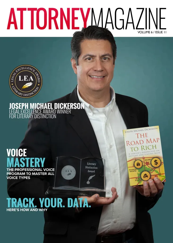 Man holding a magazine in blue background | Laredo, TX | The J.M. Dickerson Law Firm PLLC