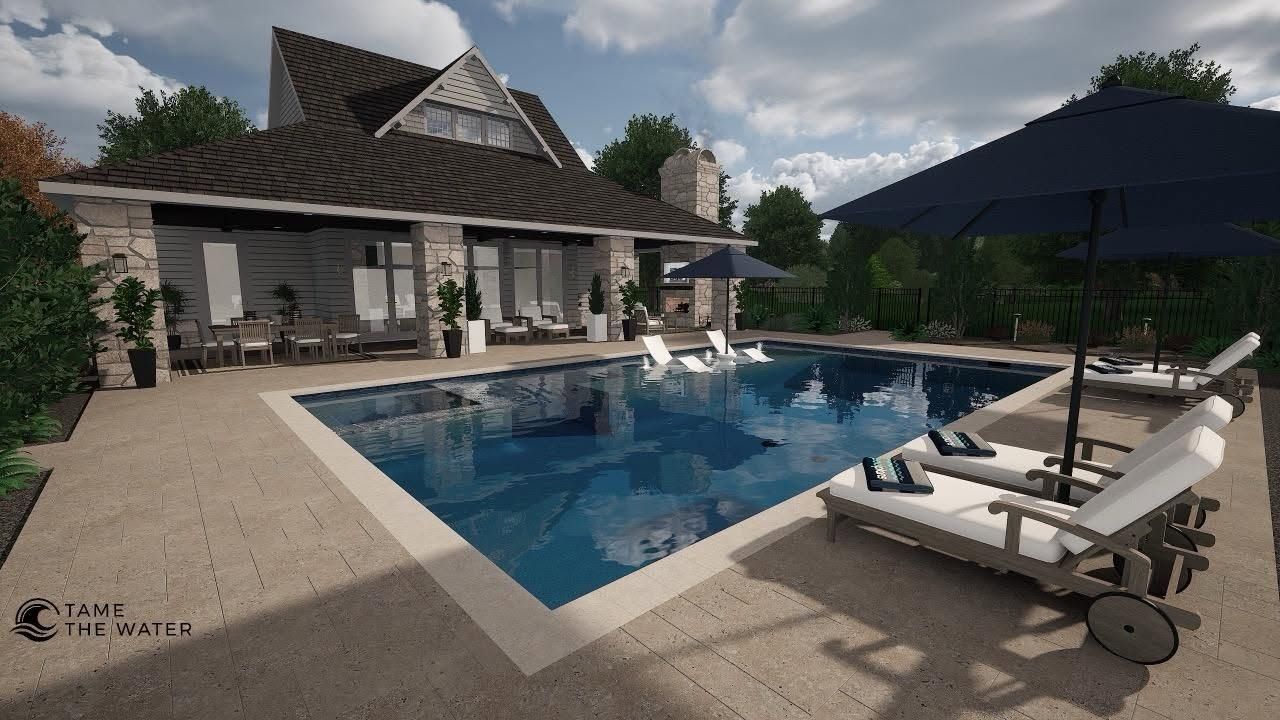 Luxury poolside patio with lounge chairs, umbrella, and a modern house under a cloudy sky