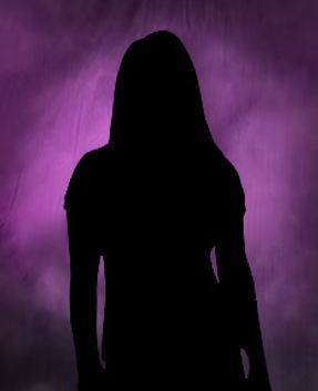 Silhouette of a person against a purple, smoky background