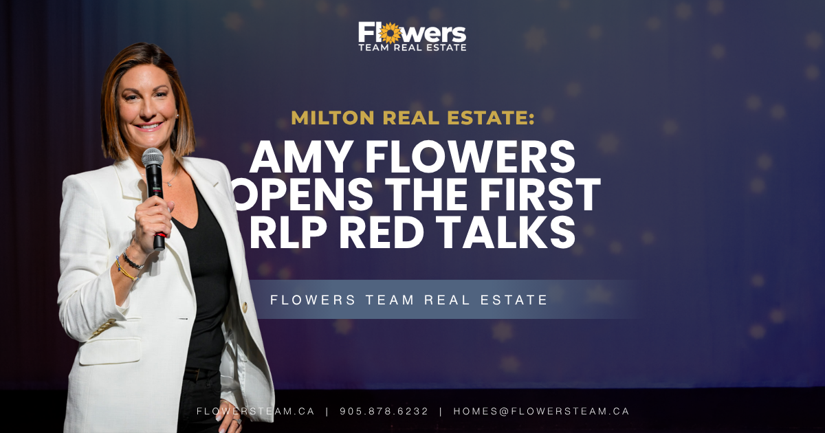 Amy Flowers on stage with microphone, announcing “Amy Flowers opens the first RLP Red Talks”