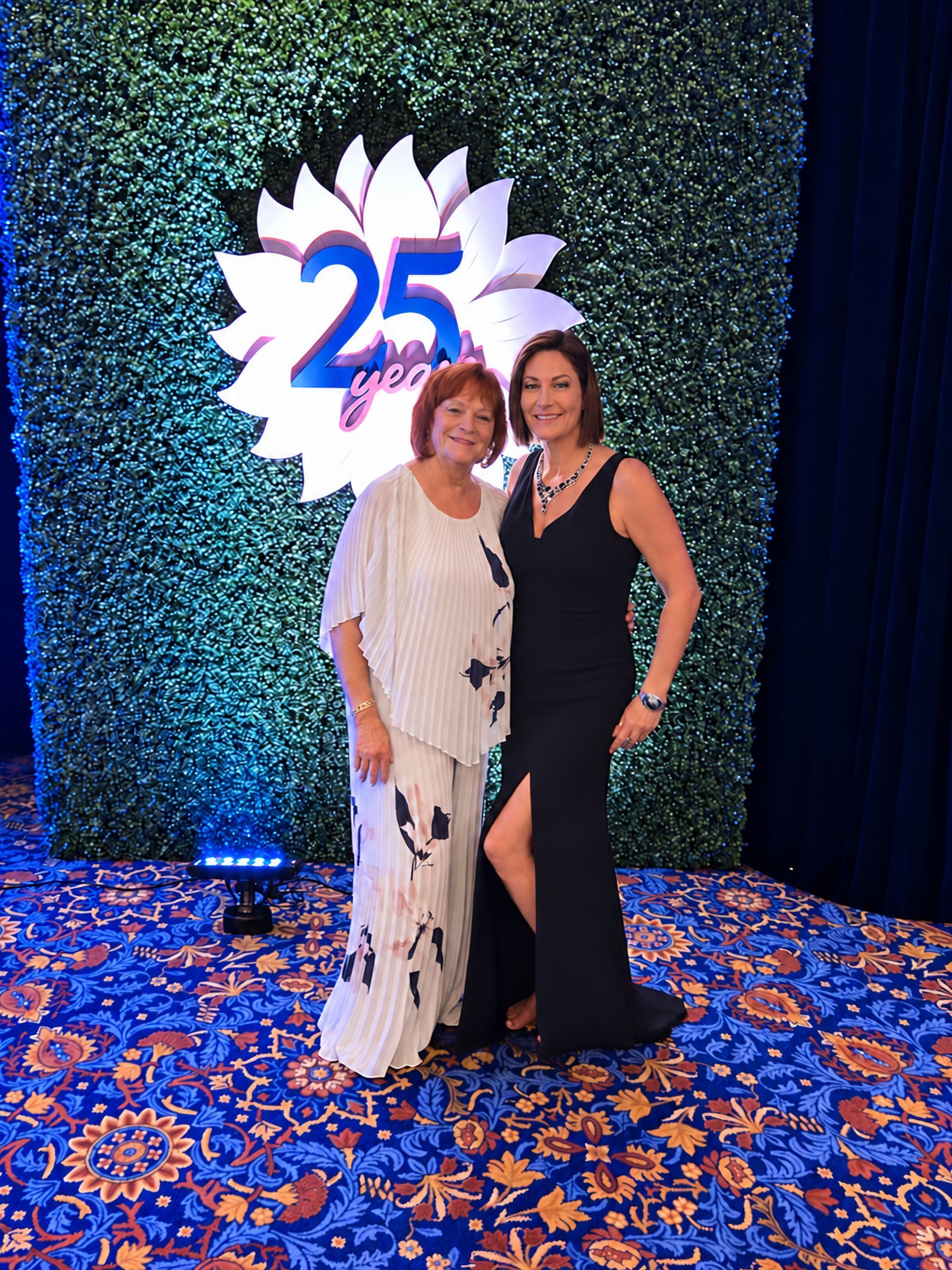Amy Flowers with mom Jane Anne Flowers Team Real Estate 25 year anniversary gala October 2026