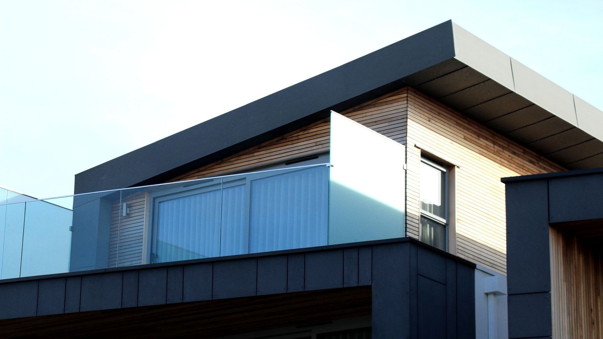 A house with a balcony on the side of it.