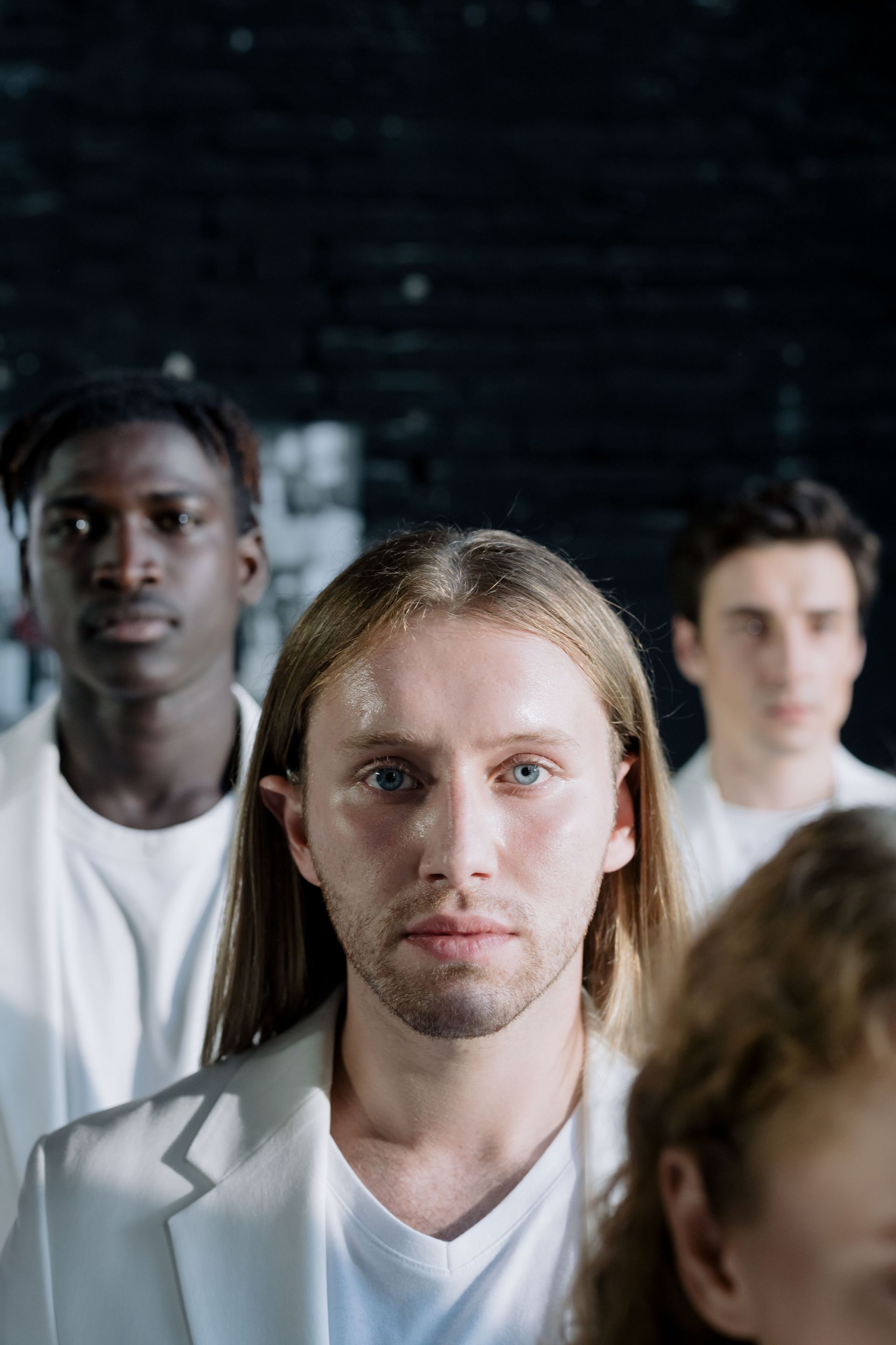 Men staring straight ahead

