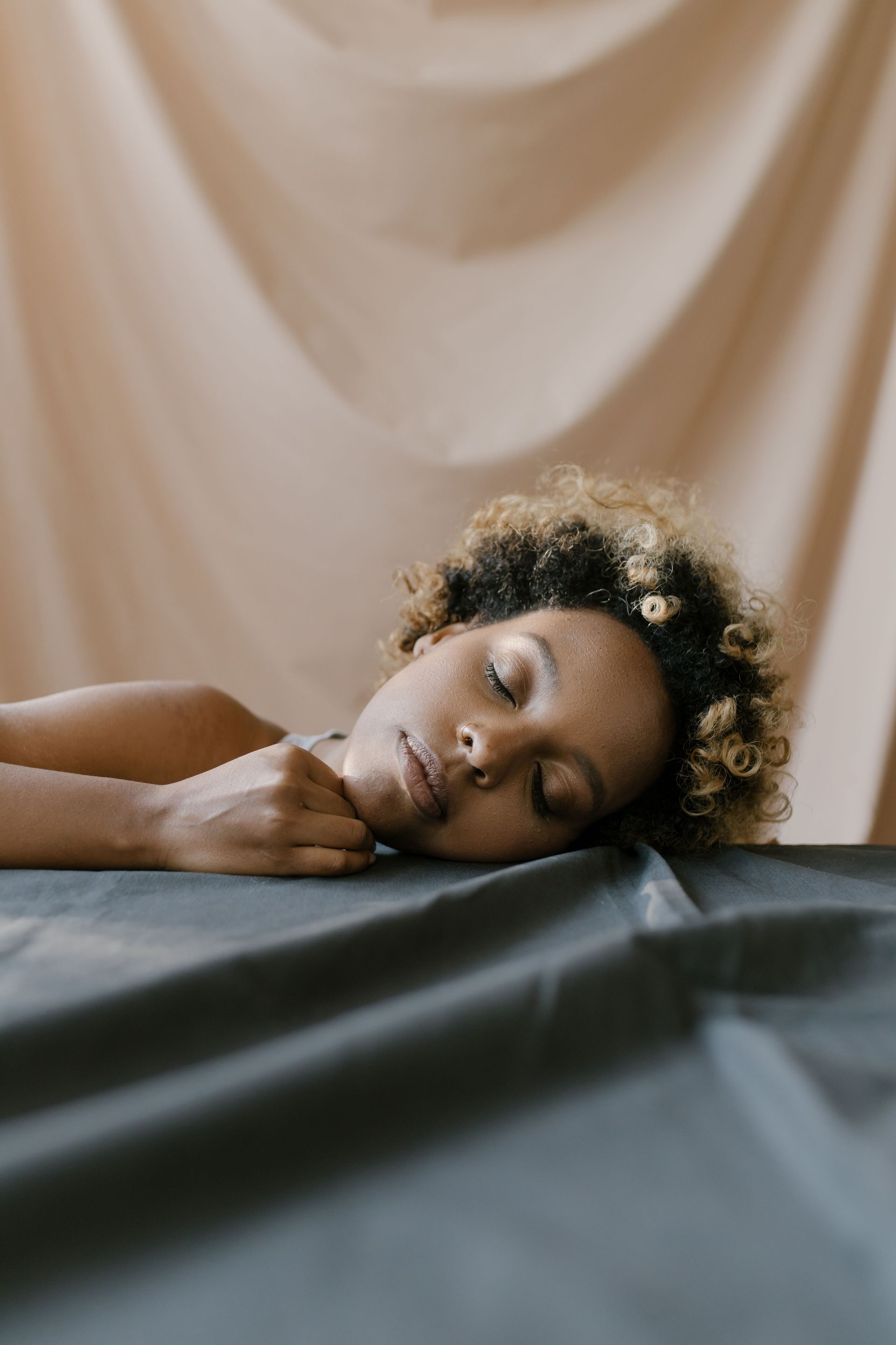 Woman resting head on table