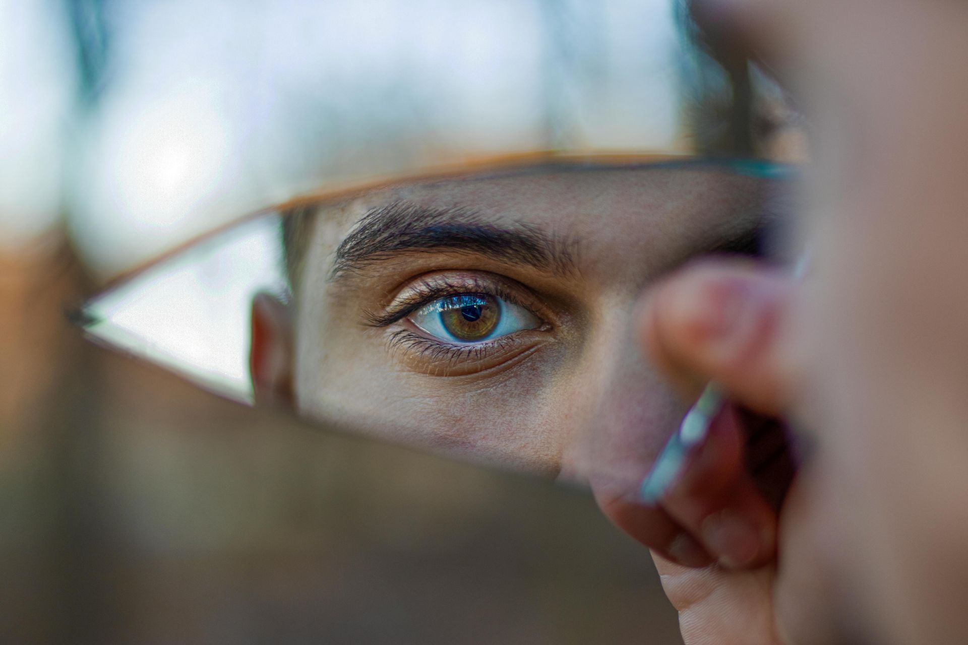 Human eye being reflected back in a mirror.