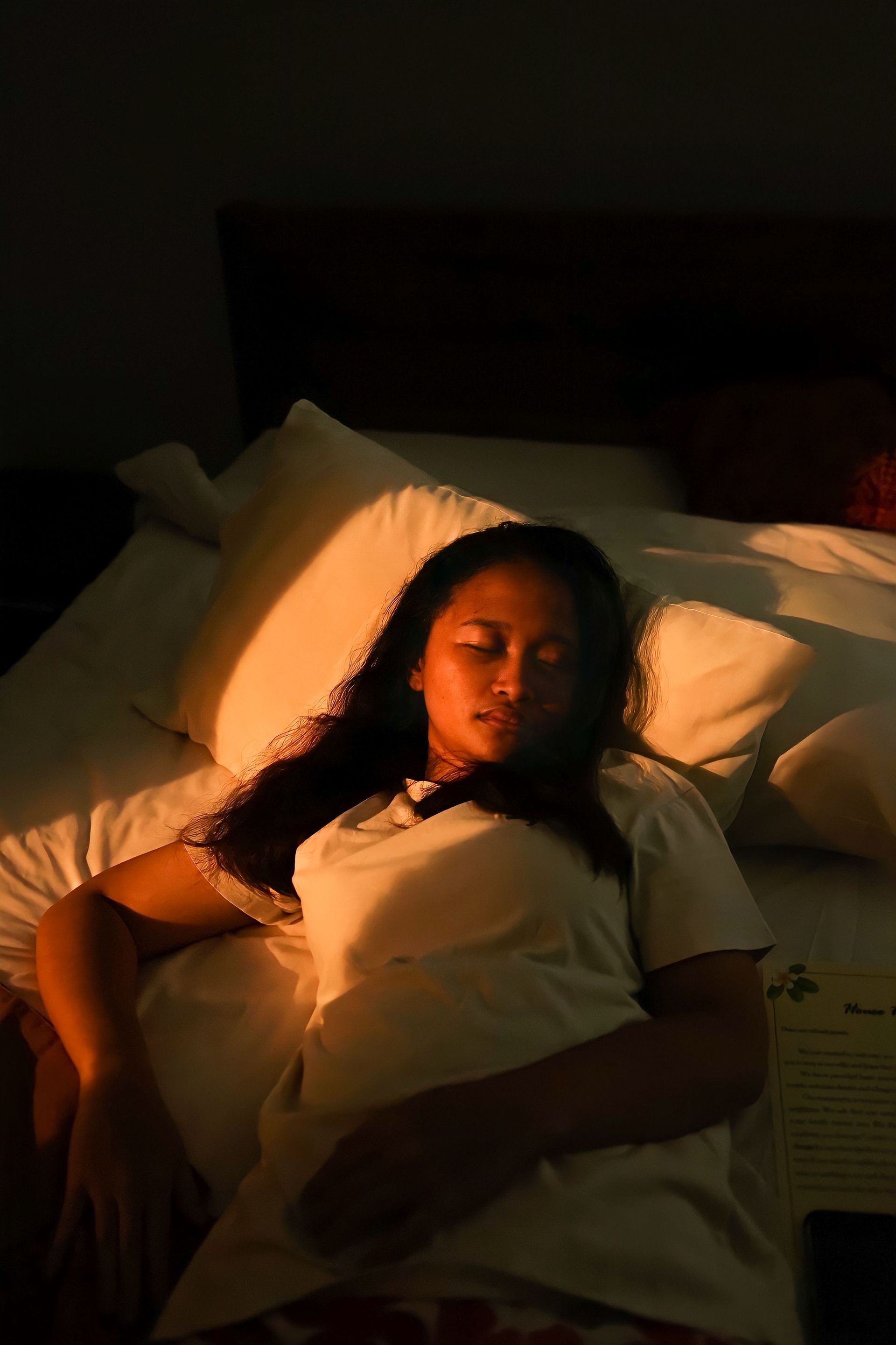 Women Sleeping while light shines on her face