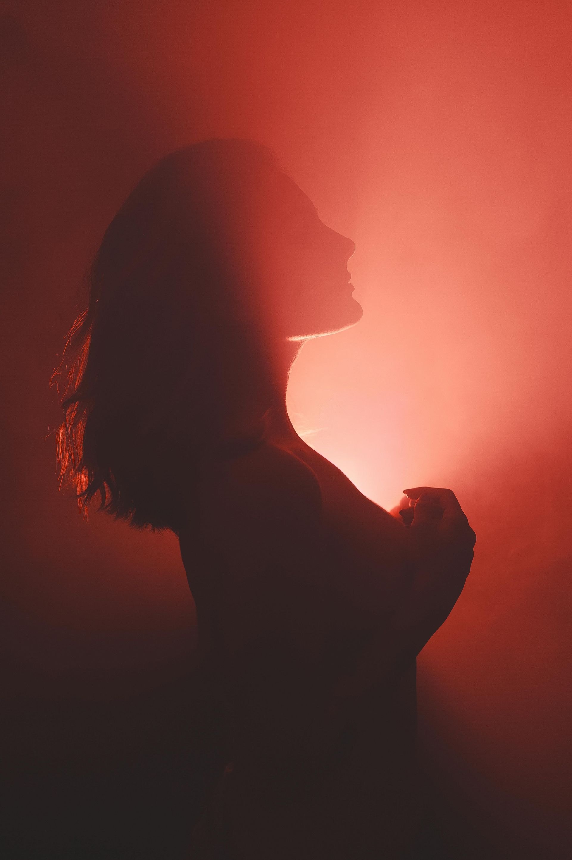 Woman with light shining behind her
