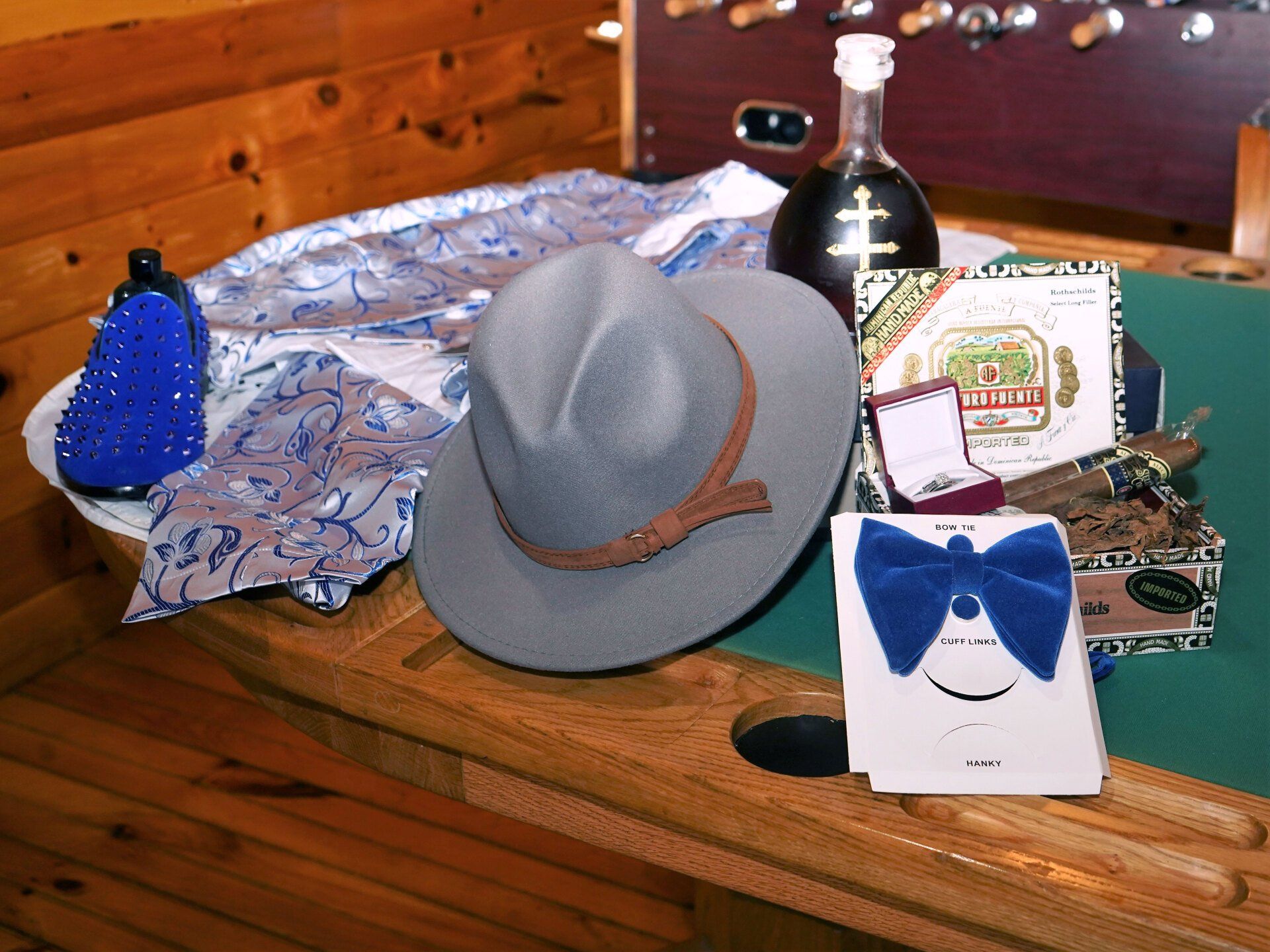 A table with a hat and a bow tie on it