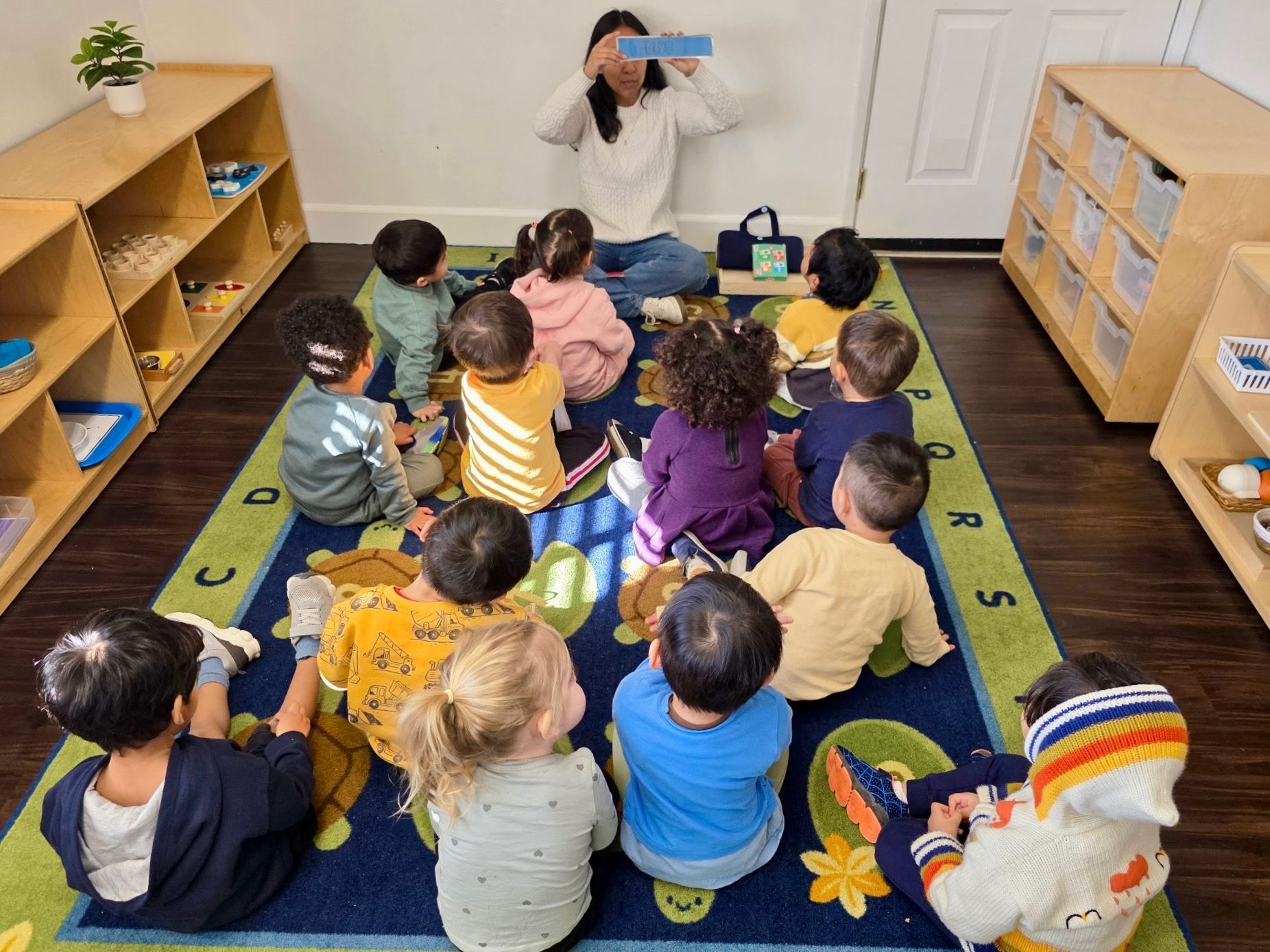 Montessori guide and child during lesson