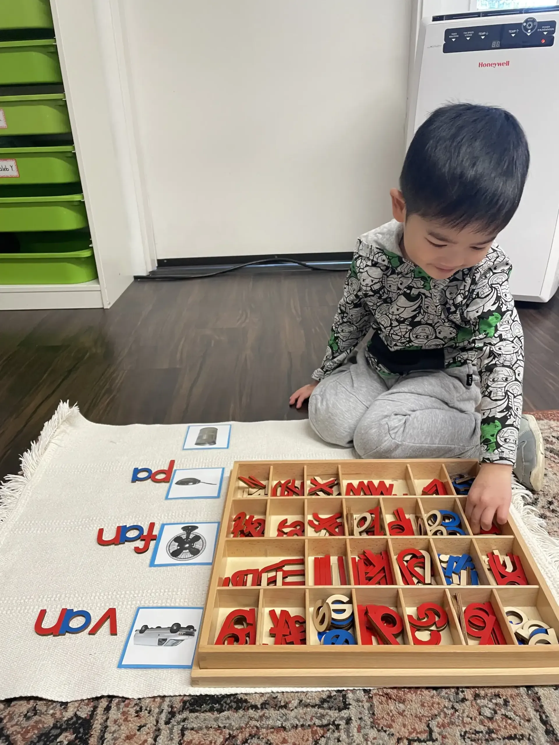 Montessori child working with language materials