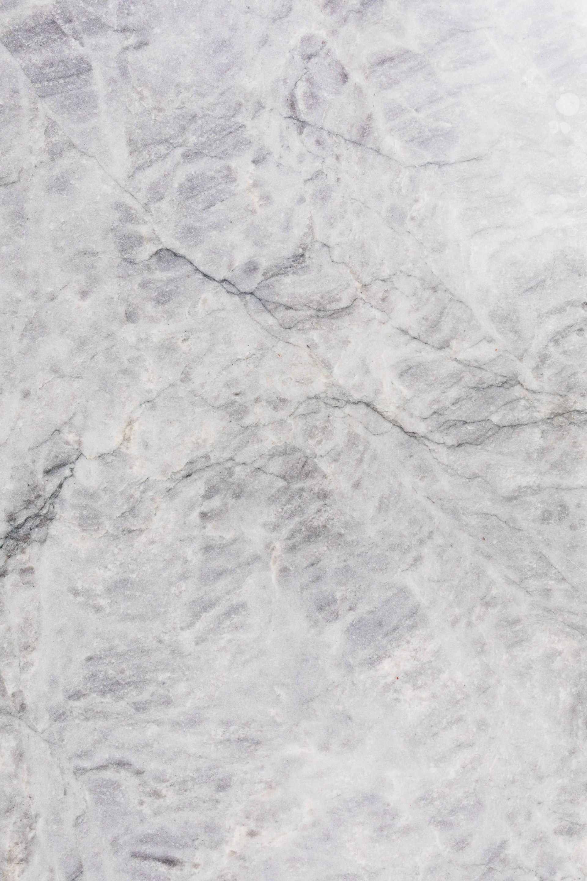 Light gray and white marble-like stone texture with subtle veining