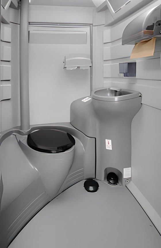 There is a toilet and a sink in the bathroom. Brazeau Sanitation