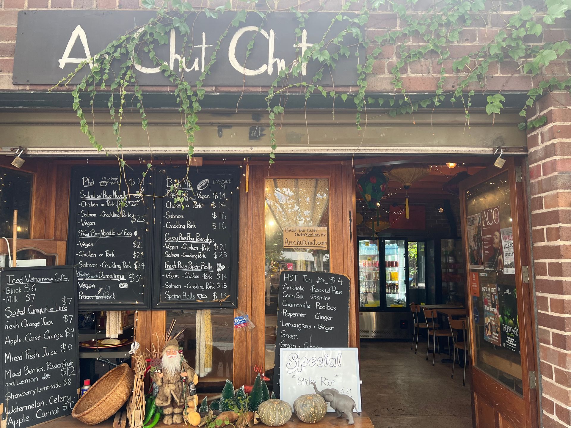 A restaurant with a sign that says a hut chat