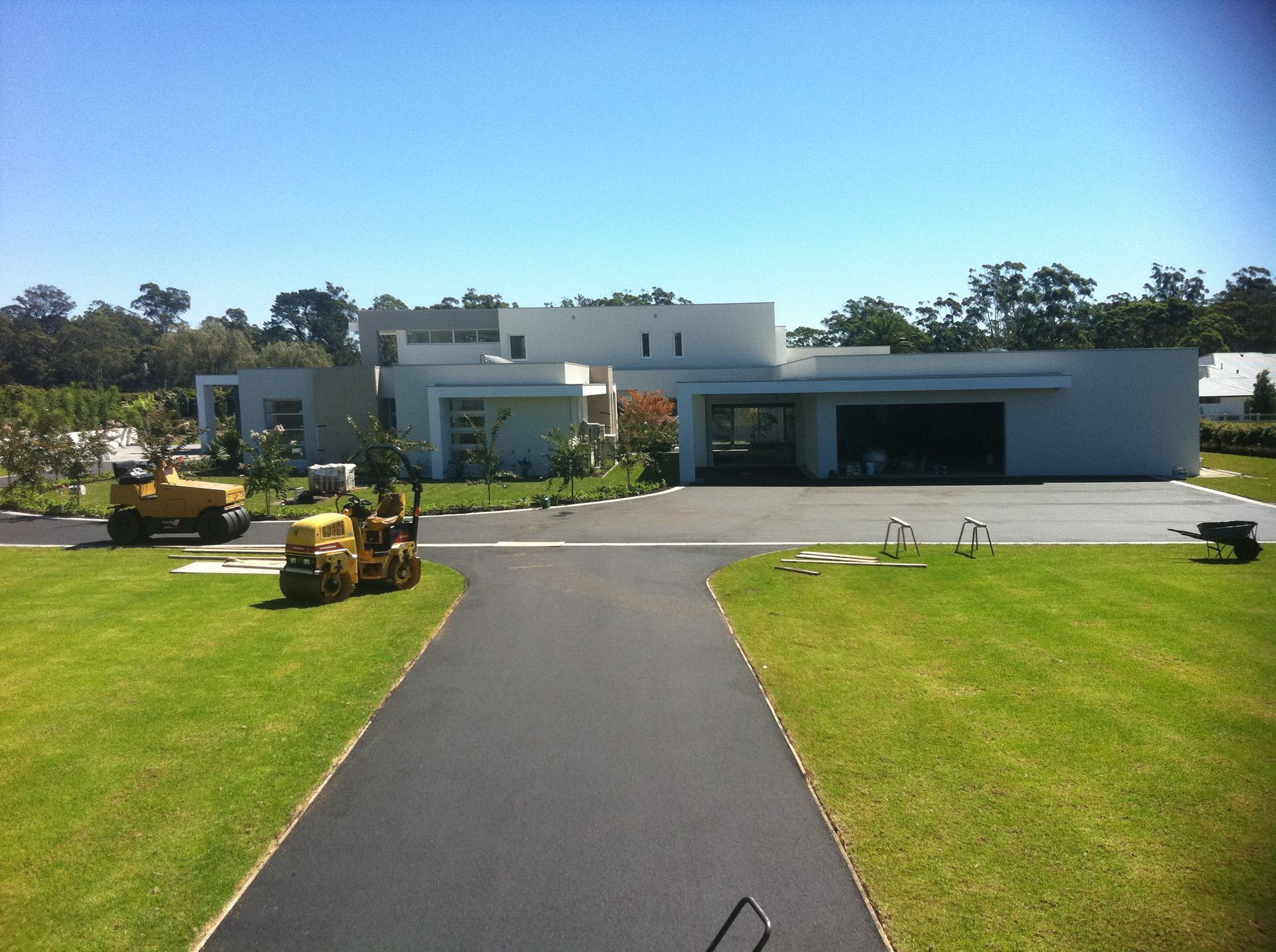 An Asphalt Road with Green Turf — Sydney, Nsw — C & C Asphalt Pty Ltd