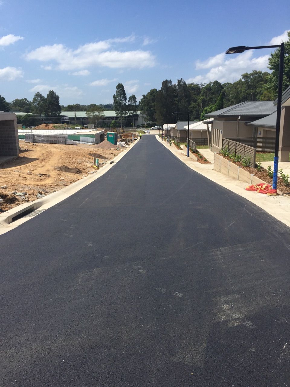 A Road with Footpaths and Many Trees in the Back of the House — Sydney, Nsw — C & C Asphalt Pty Ltd